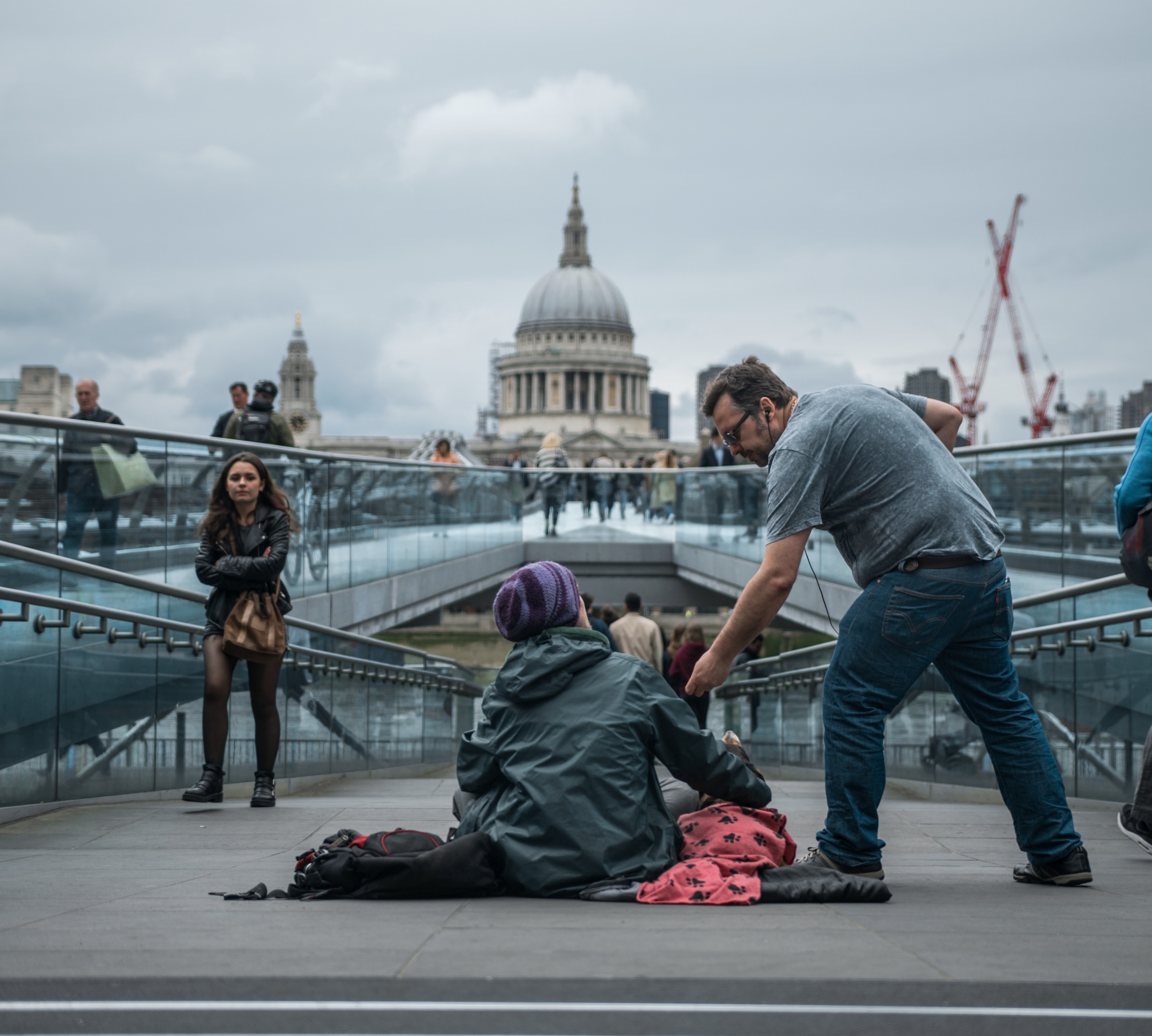 man giving to a beggar