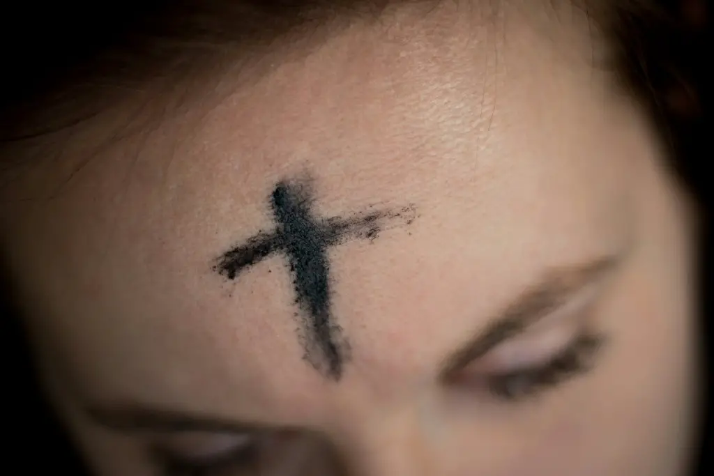 cross on the forehead with the use of ash during ash Wednesday