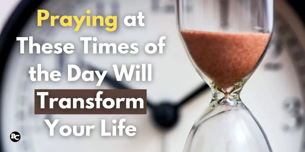An hourglass with sand flowing through it is shown in the foreground, while a clock is blurred in the background. The text reads, 'Praying at These Times of the Day Will Transform Your Life' in bold letters, emphasizing the importance of specific prayer times.