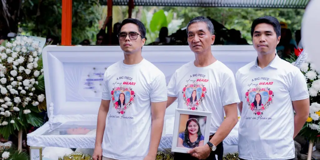 me, my brother and father in the burial of my mother