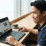 reading a christian article in the laptop